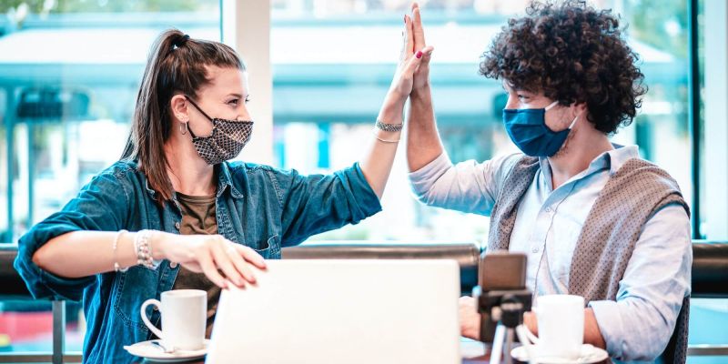 young-milenial-influencers-at-coworking-space-with-facemask.jpg